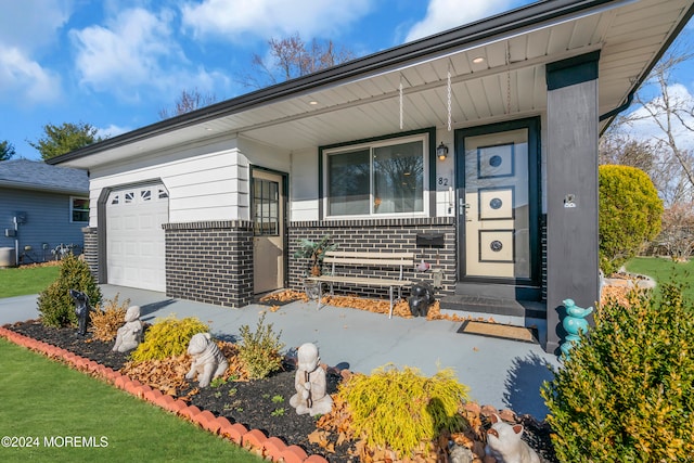 doorway to property featuring a garage