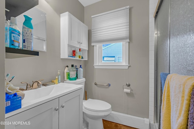 bathroom featuring vanity, a baseboard heating unit, toilet, walk in shower, and wood-type flooring