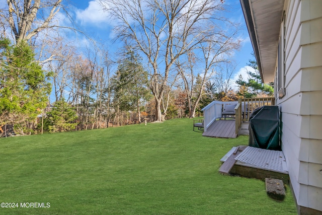 view of yard with a deck