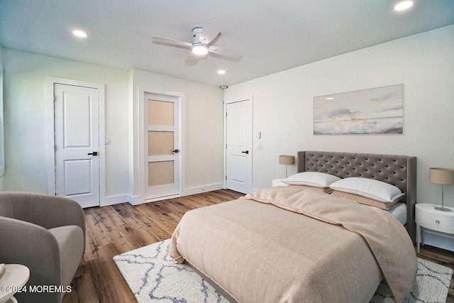 bedroom with hardwood / wood-style flooring and ceiling fan