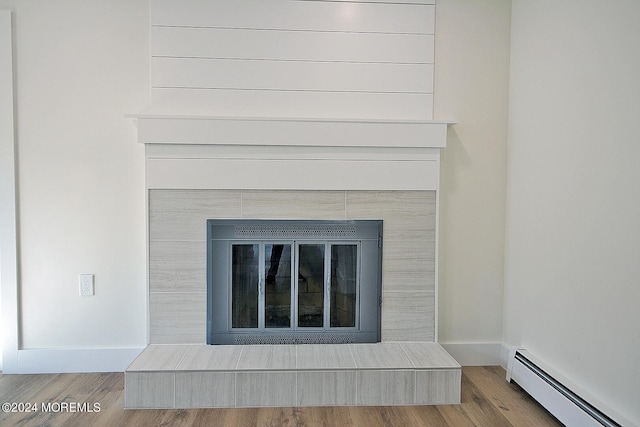 room details featuring hardwood / wood-style floors and baseboard heating