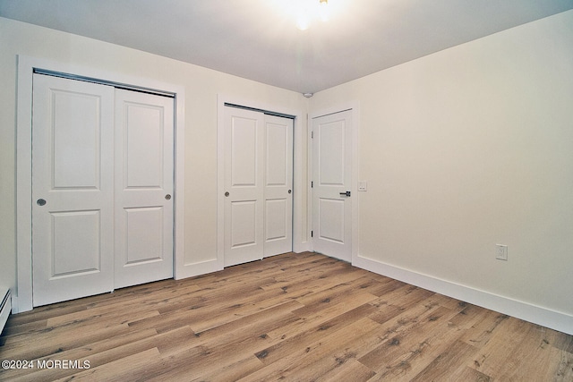 unfurnished bedroom featuring light hardwood / wood-style floors