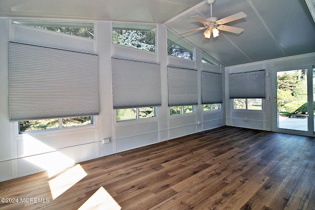 unfurnished sunroom with ceiling fan and vaulted ceiling