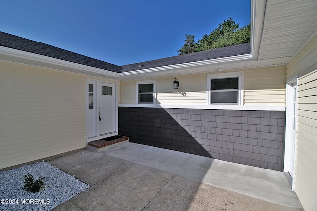 property entrance with a patio area