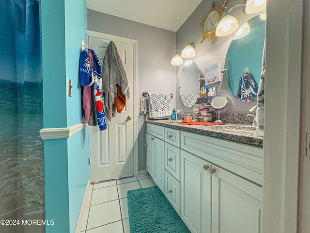 bathroom with tile patterned floors and vanity