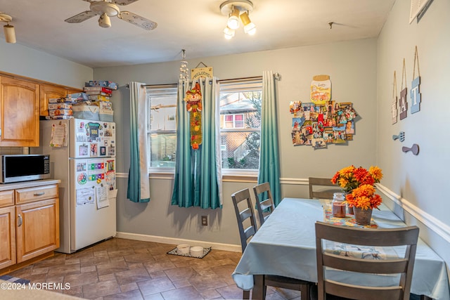 dining space featuring ceiling fan