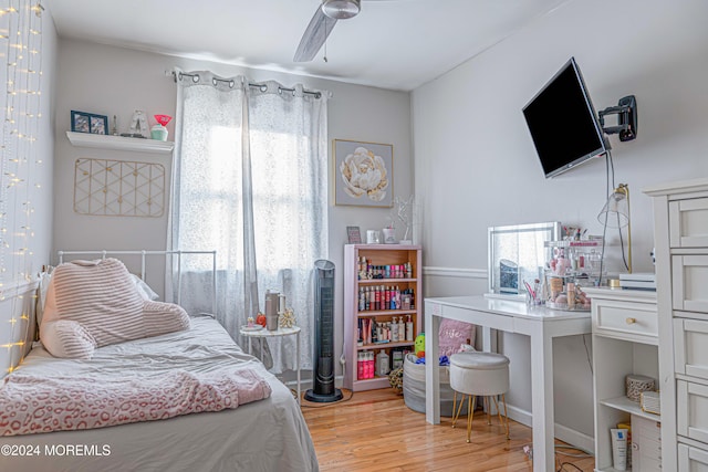 bedroom featuring light wood-type flooring and ceiling fan