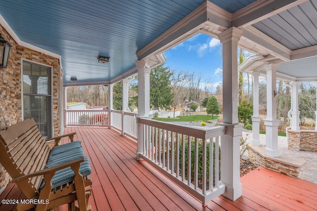 wooden terrace featuring a porch