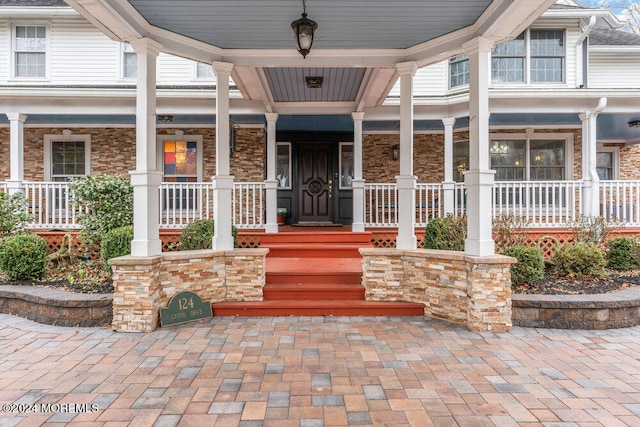 doorway to property with a porch