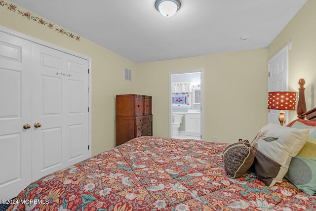 bedroom with ensuite bath and a closet