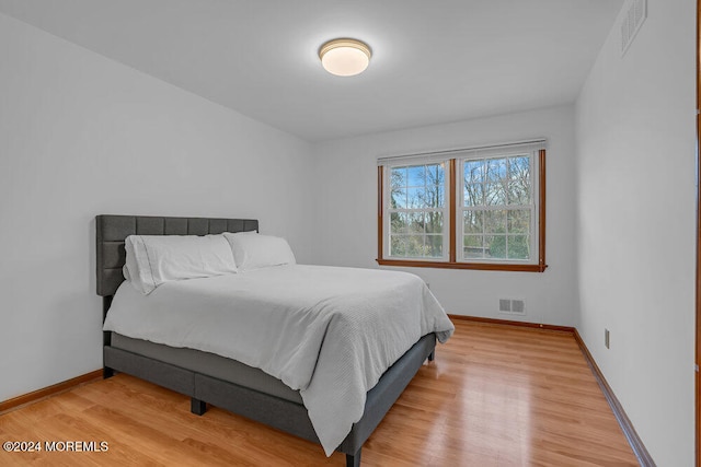 bedroom featuring wood-type flooring