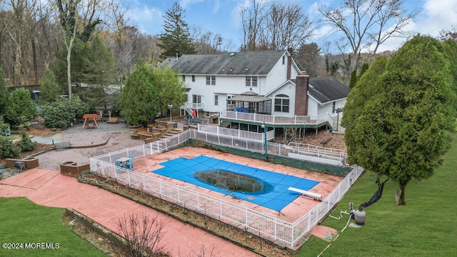 view of pool featuring a yard and a patio