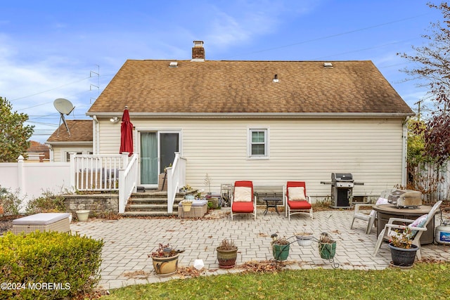 back of property featuring a patio