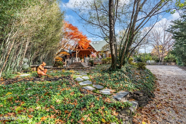 view of yard featuring covered porch