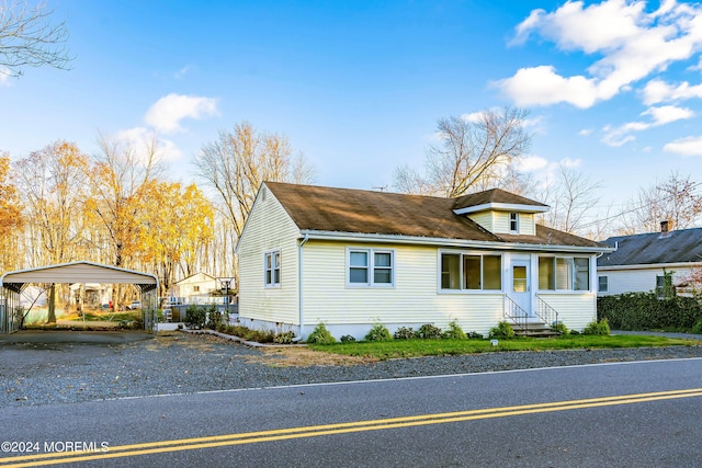 view of front of property featuring a carport