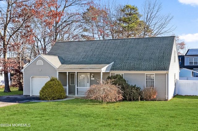 new england style home with a porch, a garage, and a front lawn