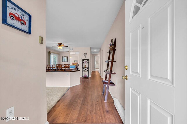 entryway featuring hardwood / wood-style flooring and ceiling fan