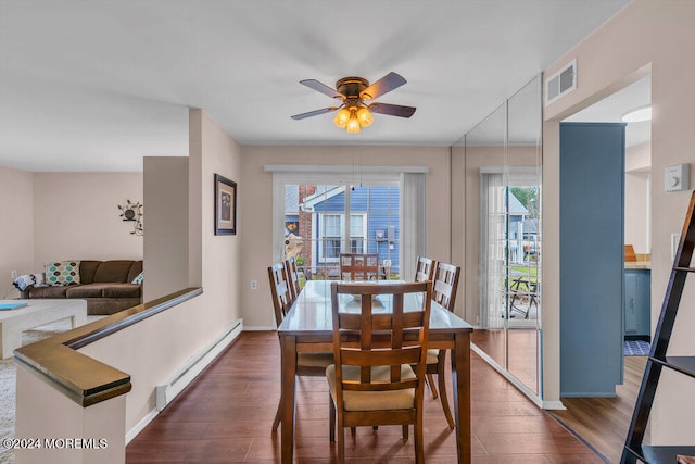 dining area with a wealth of natural light, dark hardwood / wood-style flooring, ceiling fan, and a baseboard radiator