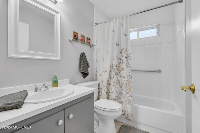 full bathroom with vanity, toilet, and shower / bath combo with shower curtain