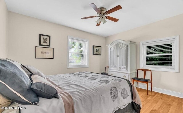 bedroom featuring light wood-type flooring and ceiling fan