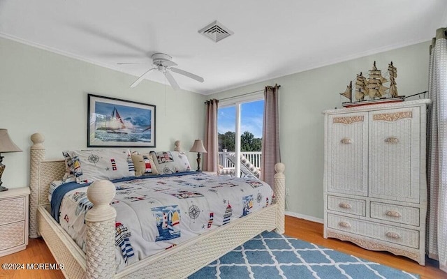 bedroom with ceiling fan, wood-type flooring, ornamental molding, and access to outside