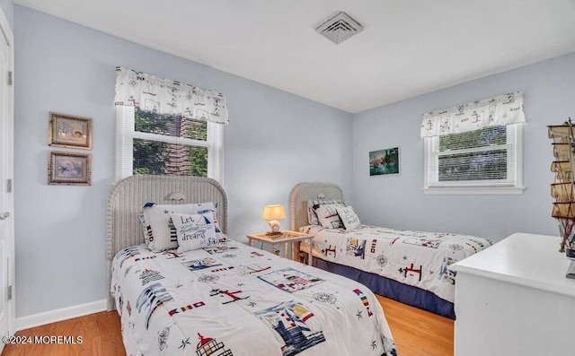 bedroom featuring wood-type flooring