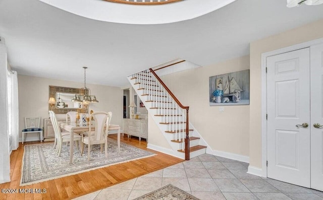 dining room with a chandelier and light hardwood / wood-style flooring