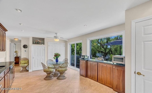 interior space featuring ceiling fan and light tile patterned floors