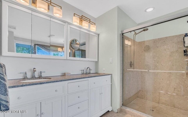 bathroom with vanity and an enclosed shower