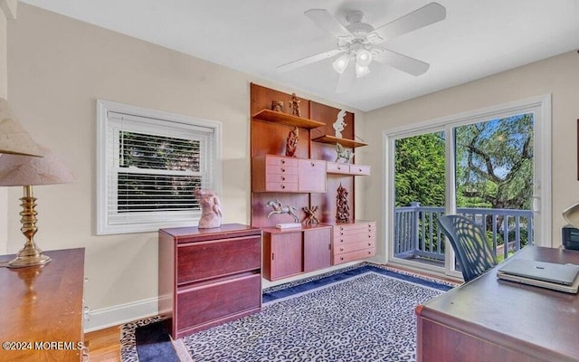 office area featuring light hardwood / wood-style floors and ceiling fan