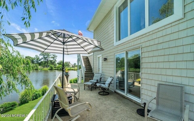 404 Ocean Rd, Spring Lake, NJ 07762 - view of patio / terrace featuring stairway and a water view