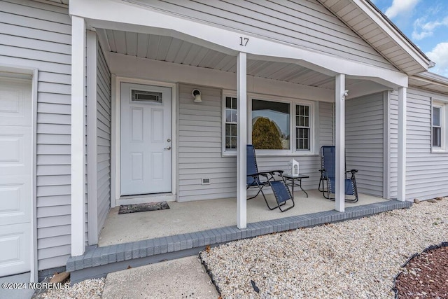 doorway to property with a porch