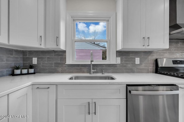 kitchen with sink, white cabinets, and stainless steel appliances