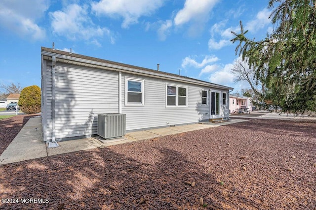 back of property with central air condition unit