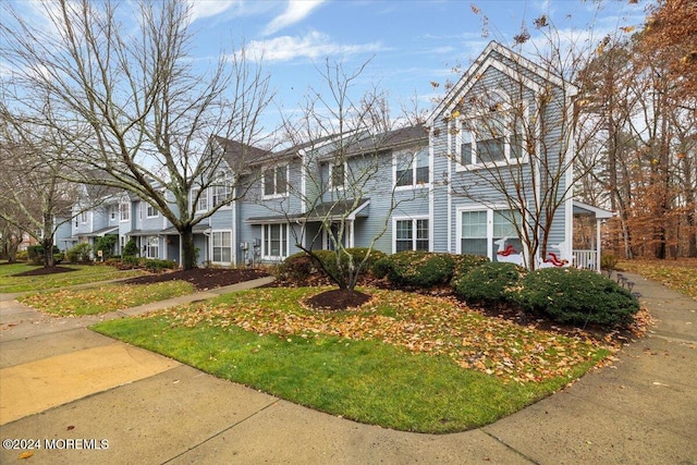 view of property with a front lawn