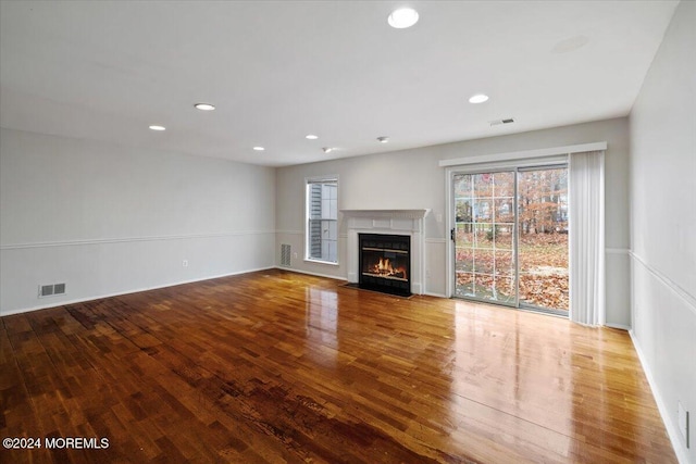 unfurnished living room featuring wood-type flooring