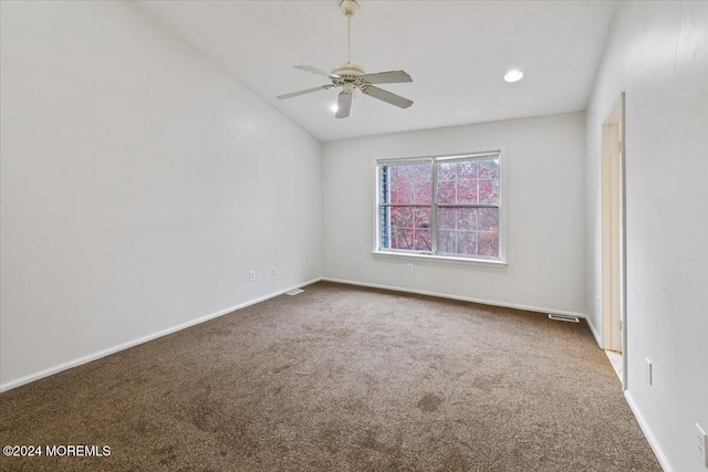 carpeted spare room with ceiling fan