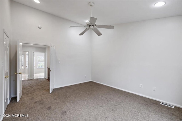 carpeted empty room featuring ceiling fan