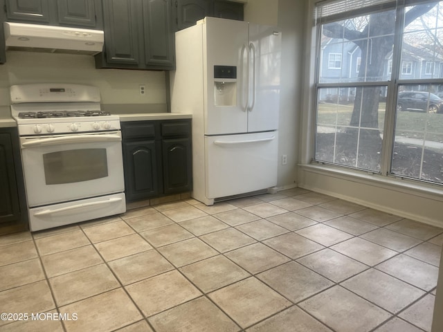 kitchen featuring white appliances and light tile patterned floors