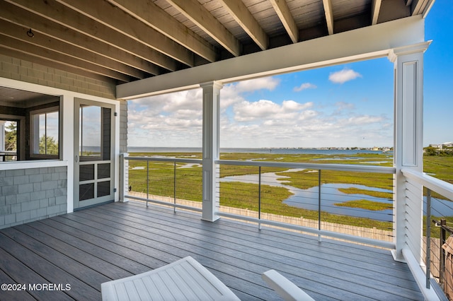 wooden terrace with a water view