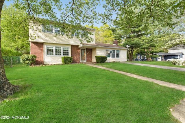 view of front of home with a front lawn