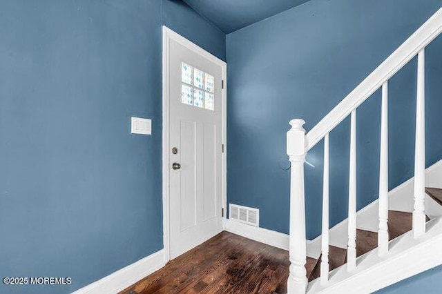 foyer with dark hardwood / wood-style flooring