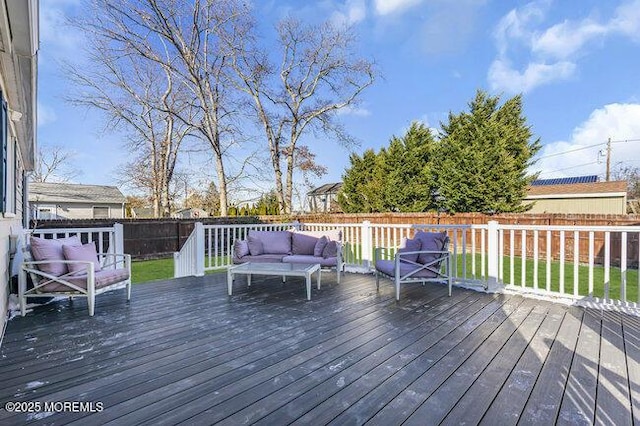 wooden terrace with outdoor lounge area