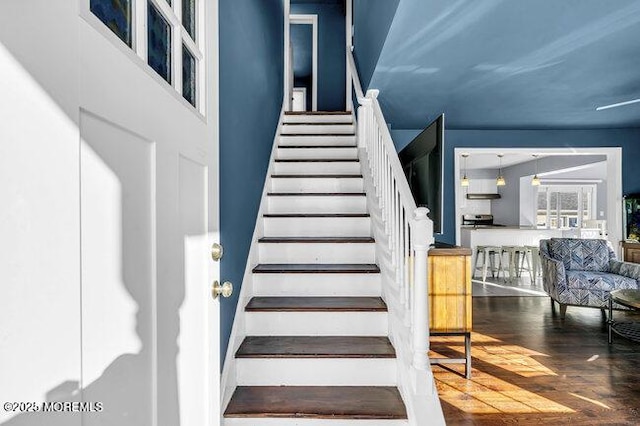 staircase featuring wood-type flooring