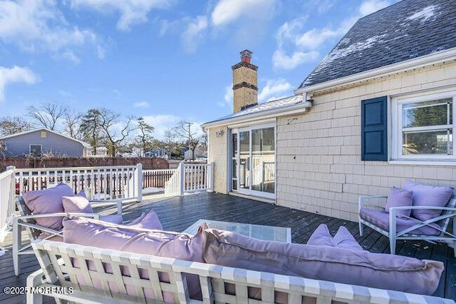 wooden deck featuring an outdoor hangout area