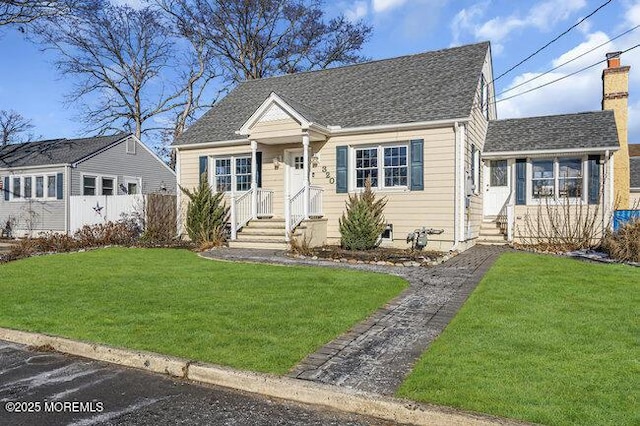 bungalow-style house with a front lawn