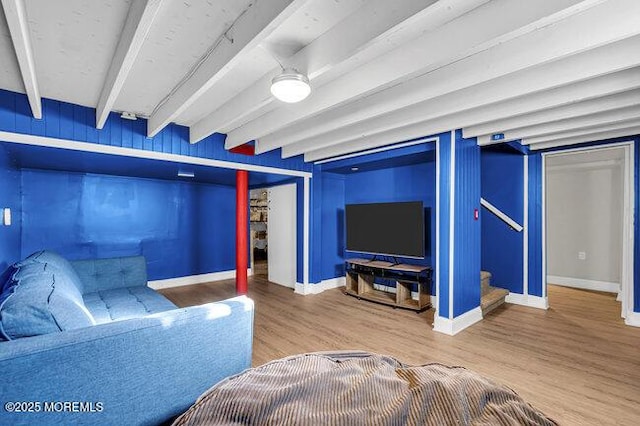 living room featuring hardwood / wood-style flooring and beamed ceiling