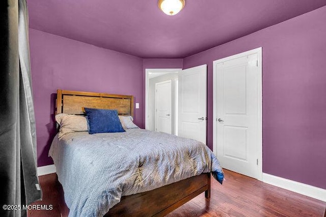 bedroom with hardwood / wood-style floors