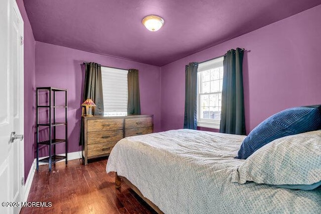 bedroom featuring dark wood-type flooring