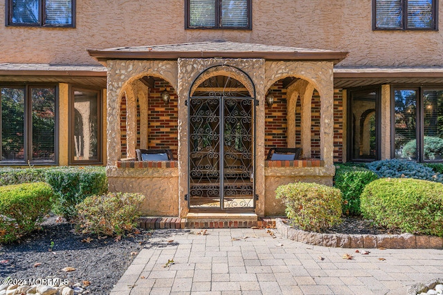 doorway to property featuring a porch